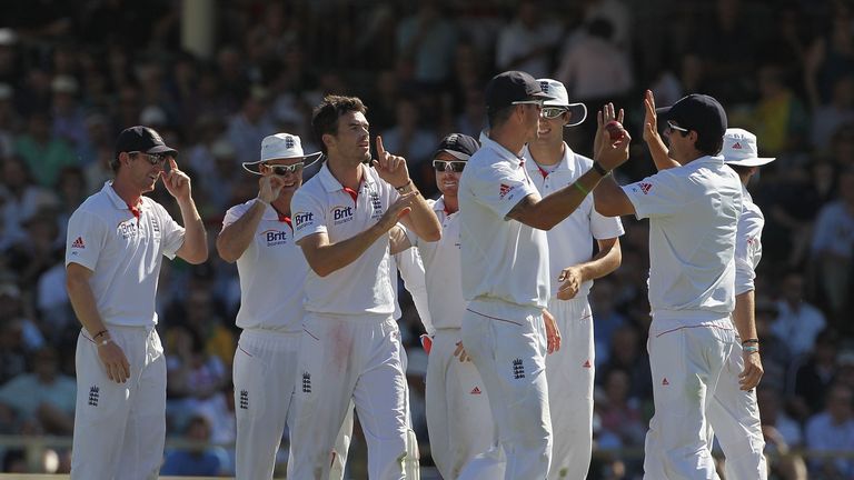 PERTH, AUSTRALIA - DECEMBER 16:  James Anderson of England celebrates the wicket of Ryan Harris of Australia with team mates during day one of the Third As