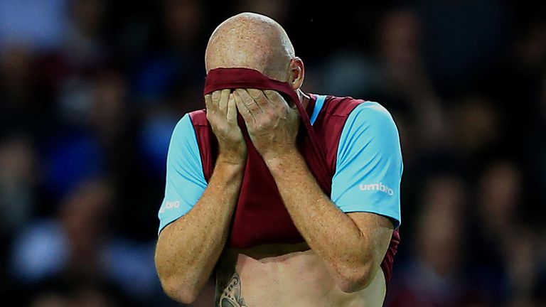 West Ham's James Collins leaves the field dejected after being shown a red card during the Europa League, Third Qualifying Round, First Leg at Upton Park