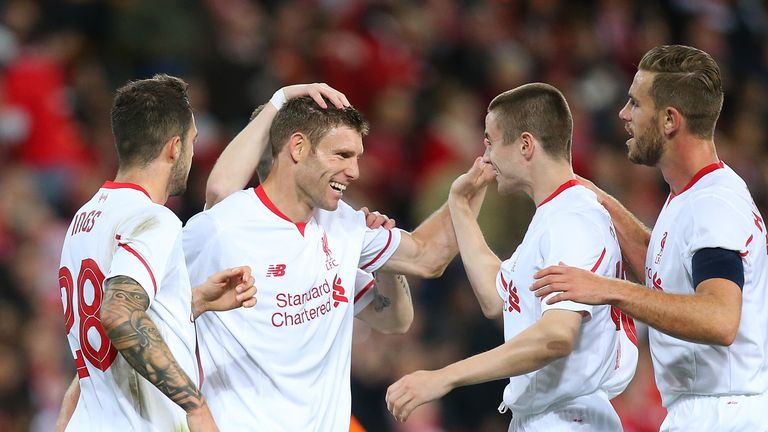 James Milner of  Liverpool FC celebrates a goal with team mates during the international friendly match between Brisbane Roar