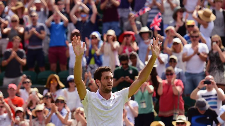 The Wimbledon crowd rise to the victorious James Ward