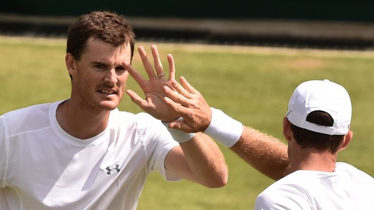 Britain's Jamie Murray (L) and his partner Australia's John Peers (R) high-five between points at Wimbledon