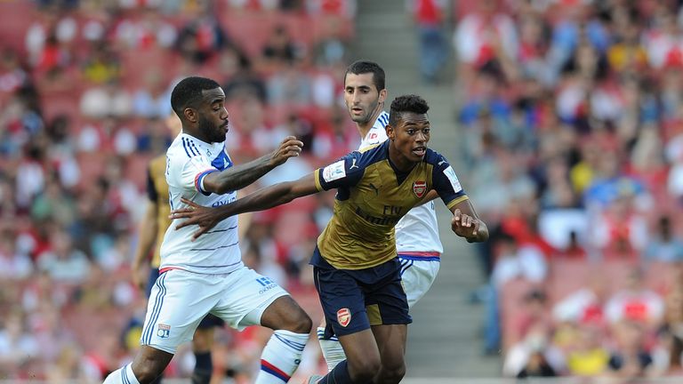 Jeff Reine-Adelaide of Arsenal breaks past Alexandre Lacazette of Lyon during the Emirates Cup match at Emirates Stadium on July 25, 2015
