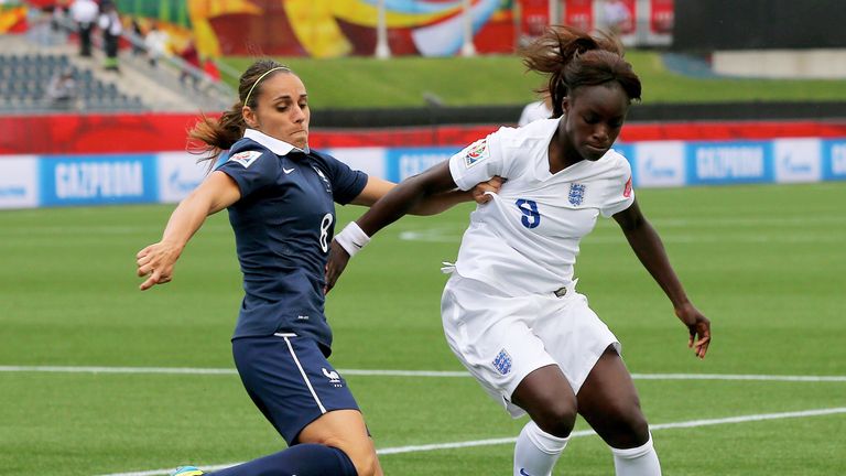Jessica Houara of France and Eniola Aluko  of England fight for the ball during the FIFA Women's World Cup