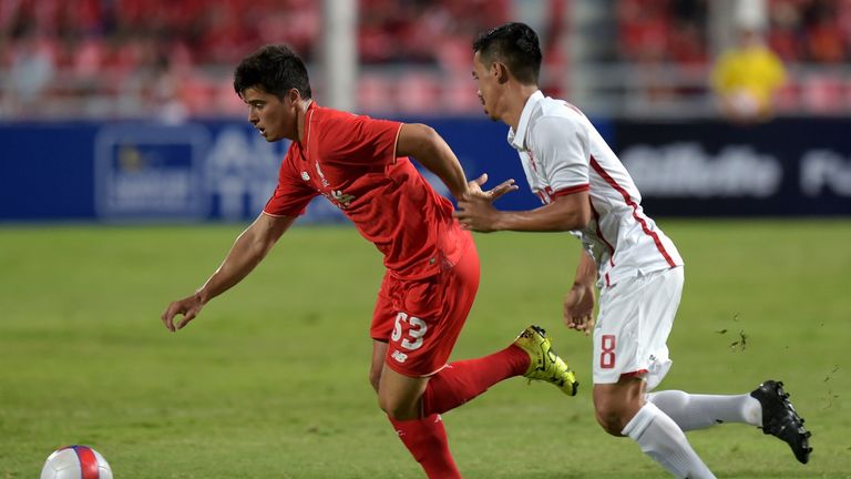Liverpool football player Joao Carlos Teixeira (L) battles for the ball with Witthaya Madlam (R) of Thailand All Stars 