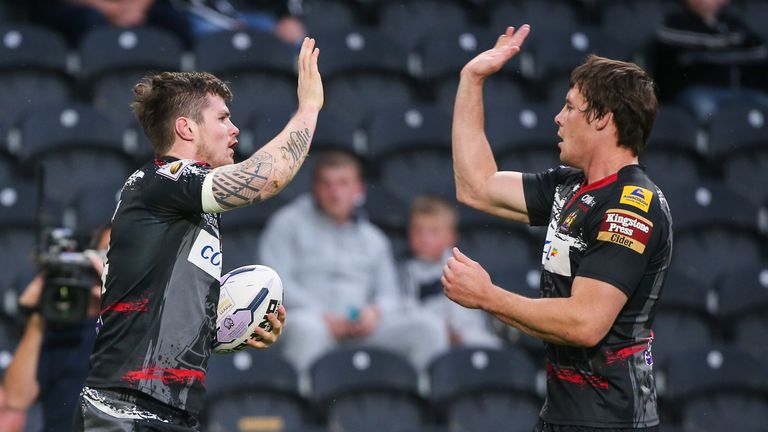Wigan's John Bateman (L) celebrates his try with Joel Tomkins (R).