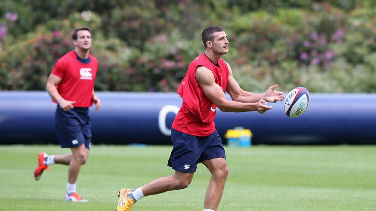 Jonny May passes the ball during the England training