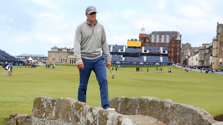 Jordan Spieth walks across Swilcan Bridge during practice ahead of the 144th Open Championship at St Andrews