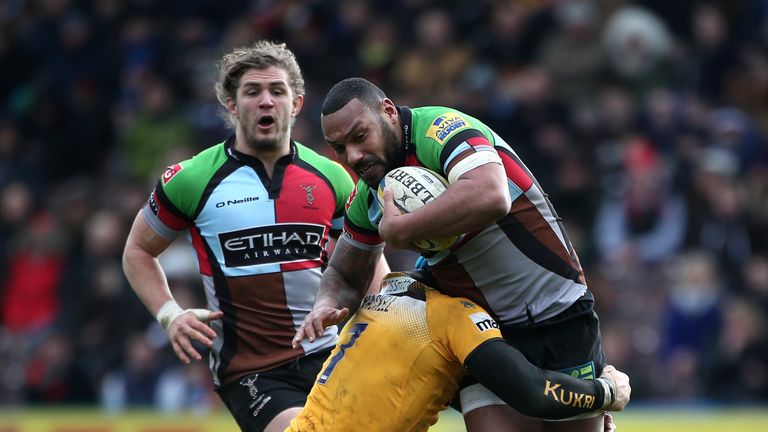 Jordan Turner-Hall of Quins is tackled by Wasps' James Haskell