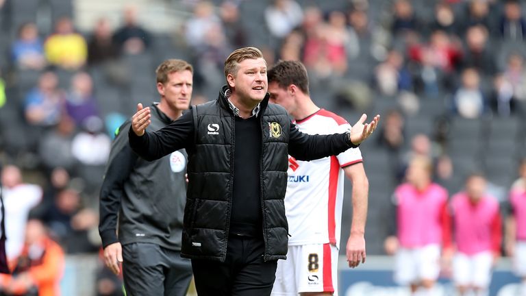 MK Dons manager Karl Robinson shouts encouragement to his players during the Sky Bet League One match between MK Dons and