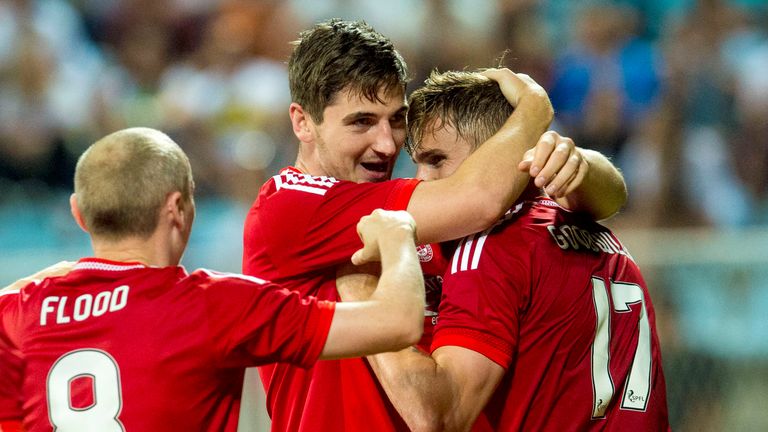 Kenny McLean (middle) celebrates after scoring Aberdeen's third against Rijeka
