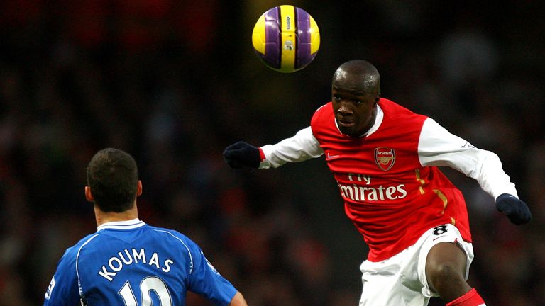 LONDON - NOVEMBER 24:  Lassana Diarra of Arsenal heads the ball over Jason Koumas of Wigan during the Barclays Premier League match between Arsenal and Wig