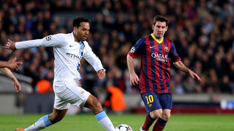 Joleon Lescott of Manchester City is shadowed by Lionel Messi of Barcelona during the UEFA Champions League Round of 16, seco