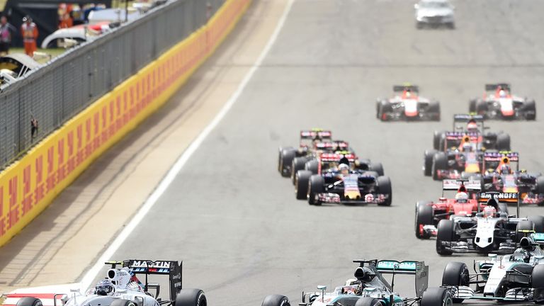 Mercedes driver Lewis Hamilton (seconf from left) goes into the first corner in 3rd position during the 2015 British Grand Prix at Silverstone