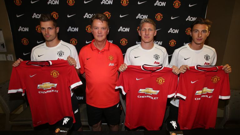 Manager Louis van Gaal of Manchester United poses with his new signings.