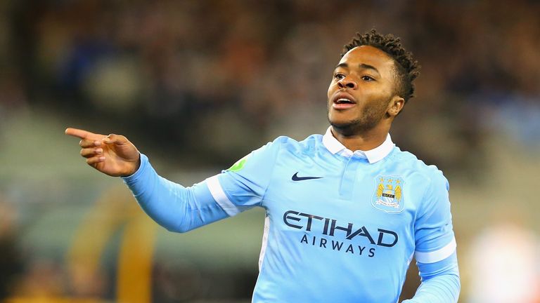 Raheem Sterling wheels away in celebration after his first City goal
