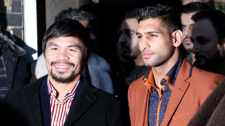 LONDON, ENGLAND - JANUARY 23:  Manny Pacquiao and Amir Khan pose after holding discussions about the possibility of a future fight, at Fitzroy Lodge Amateu