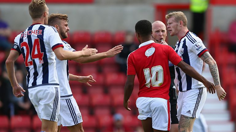 James McClean (R)  of  West Bromwich Albion squares up to Nathan Byrne (#10) of Swindon Town