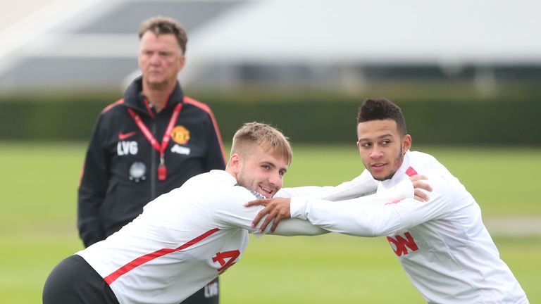 Manager Louis van Gaal watches Memphis Depay of Manchester United in action during a first team training session
