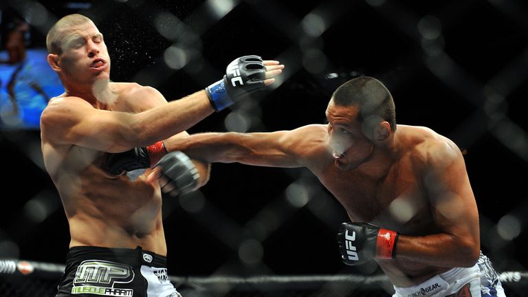 LAS VEGAS - JULY 11:  (R-L) Dan Henderson connects with a right to Mike Bisping during their middleweight bout during UFC 100 on July 11, 2009 in Las Vegas