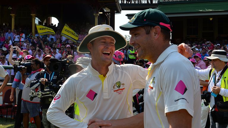 Australia cricket team captain Michael Clarke (L) and paceman Ryan Harris celebrate 5-0 victory in the Ashes Test Cricket series against England at the Syd