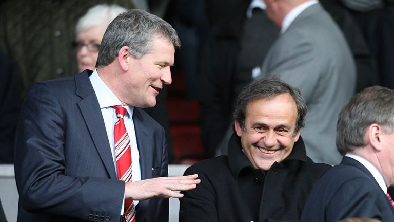 David Gill and Michel Platini share a joke at Old Trafford during Gill's time as Manchester United chief executive