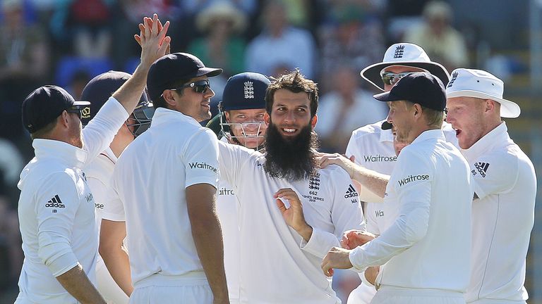 Moeen Ali is congratulated by team-mates after dismissing Australian captain Michael Clarke