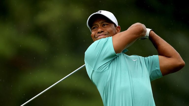 Tiger Woods tees off on the 11th hole during the first round of the Greenbrier Classic at the Old White TPC 