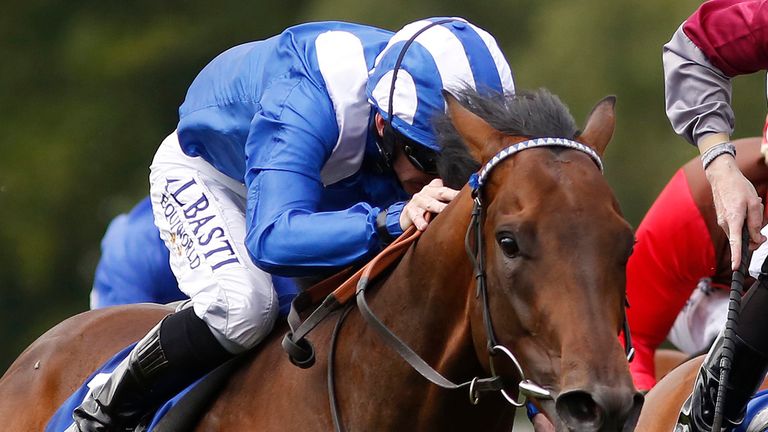 NEWMARKET, ENGLAND - JULY 11:  Paul Hanagan riding Muhaarar (L) wins The Darley July Cup from Tropics (C, spotted cap) at Newmarket racecourse on July 11, 