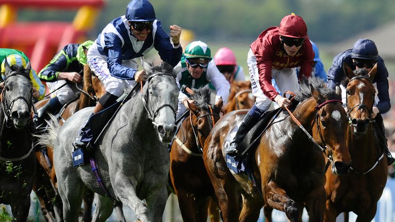 Richard Hughes riding Sky Lantern celebrates winning The Qipco 1000 Guineas Stakes, Richard's first classic success