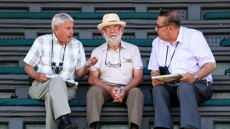 Racegoers discuss the 'form' before day two of the July Festival at Newmarket