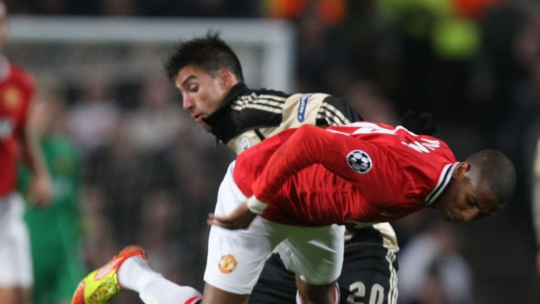 Gaitan tangles with Ashley Young in a Champions League clash