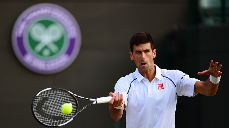 Novak Djokovic plays a forehand against Kevin Anderson