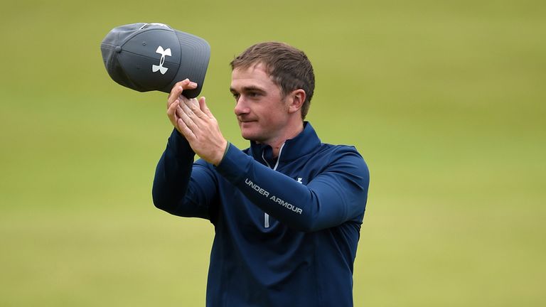 Amateur Paul Dunne of Ireland applauds the crowd on the 18th green during the second round of the 144th Open Championship 
