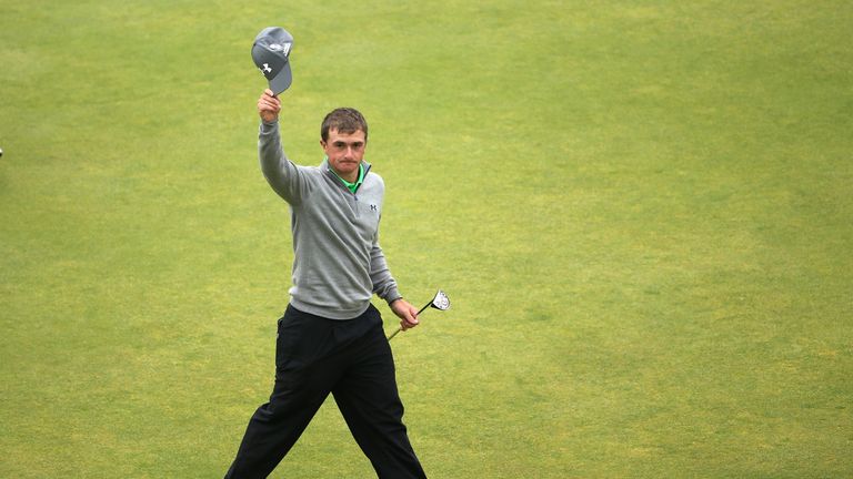 Paul Dunne waves to the crowd