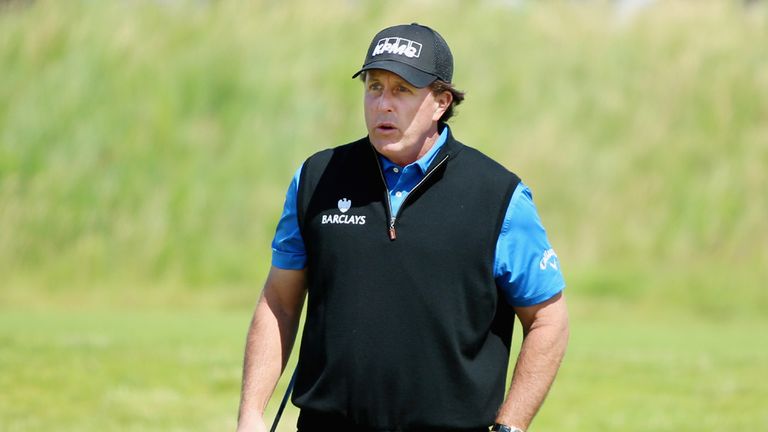 Phil Mickelson of the United States reacts to his chip shot on the third hole during the first round of the Scottish Open