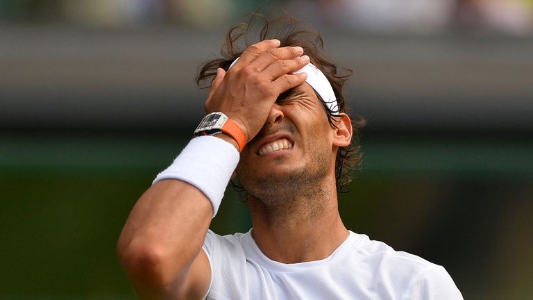 Spain's Rafael Nadal reacts after a point against Germany's Dustin Brown during their men's singles second 