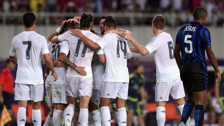 Real Madrid's players celebrate a goal during the International Champions Cup football match between Inter Milan and Real Madrid in Guangzhou on July 27