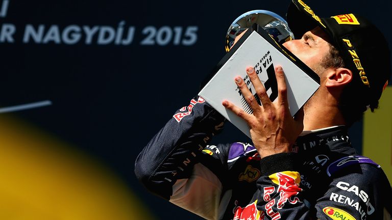 Daniel Ricciardo celebrates on the podium after finishing third in the Hungarian GP