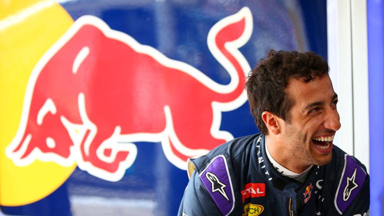 Daniel Ricciardo laughs in the garage 