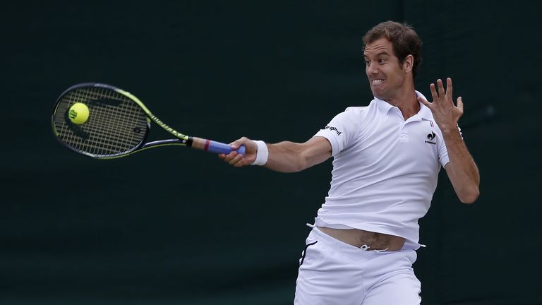 France's Richard Gasquet returns against Australia's Nick Kyrgios during their men's singles fourth round match on day seven of Wimbledon