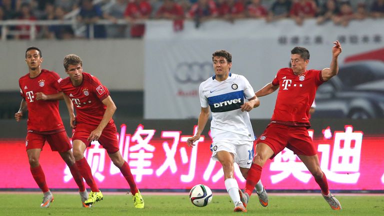 Robert Lewandowski (R) of Bayern Munich battles for the ball with Mateo Kovacic of Inter Milan during the international friendly match in Shanghai