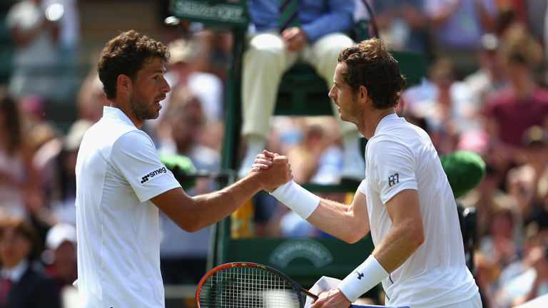 Andy Murray shakes hands with Robin Haase after reaching the third round at Wimbledon