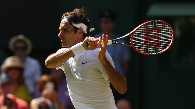 Roger Federer in action against Sam Groth in the third round of Wimbledon