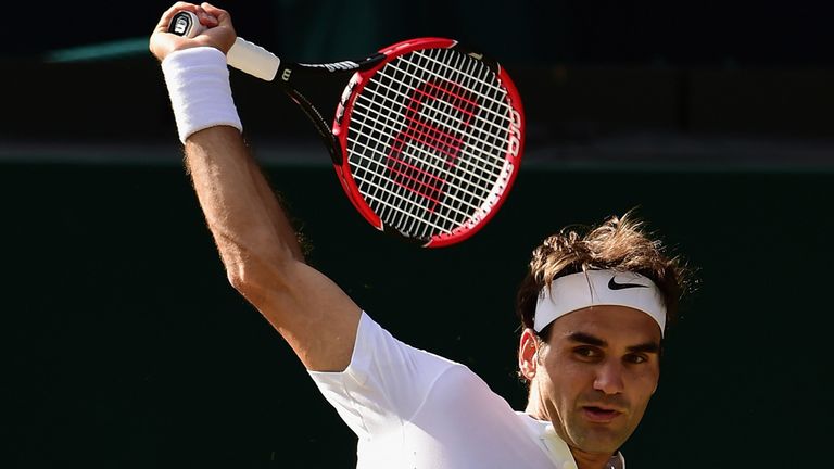 Roger Federer of Switzerland plays a backhand in the Wimbledon semi-final against Andy Murray