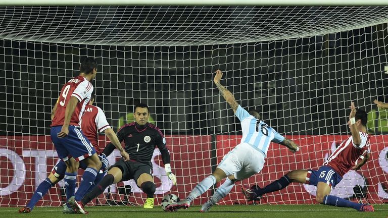 Argentina's defender Marcos Rojo scores the opener