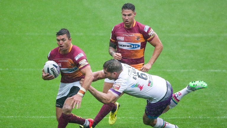 Huddersfield's Danny Brough is tackled by Hull KR's Maurice Blair