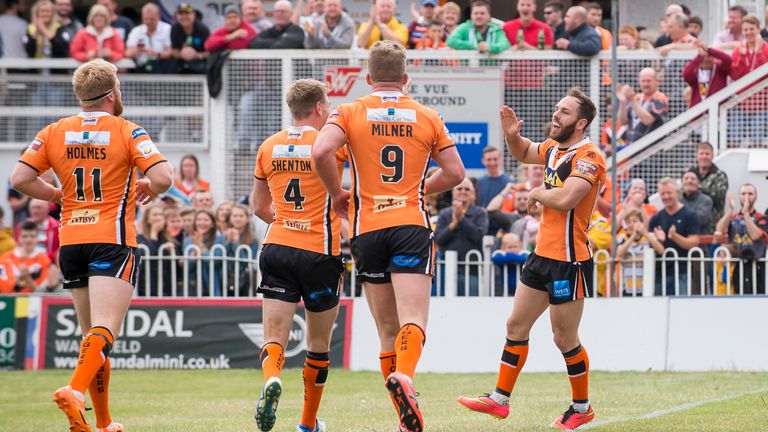 Castleford's Luke Gale (right) is congratulated by his team-mates after scoring a try against Wakefield