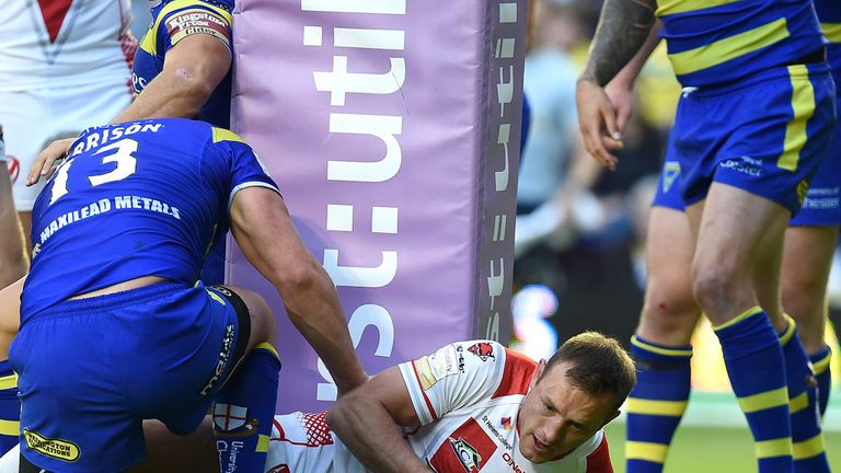 St Helens James Roby goes over for a try against Warrington Wolves, during the Super League match at Halliwell Jones Stadium, Warrington.