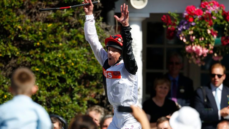 Frankie Dettori leaps from Golden Horn in the winner's enclosure after winning the Coral-Eclipse at Sandown