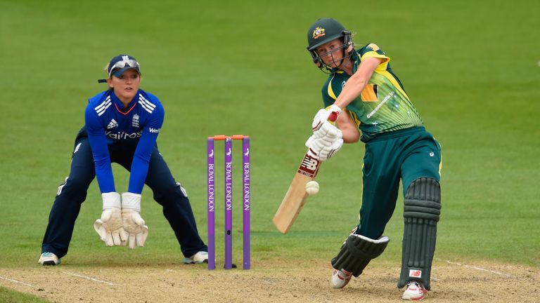 England keeper Sarah Taylor looks on as Australia batsman Meg Lanning hits out
